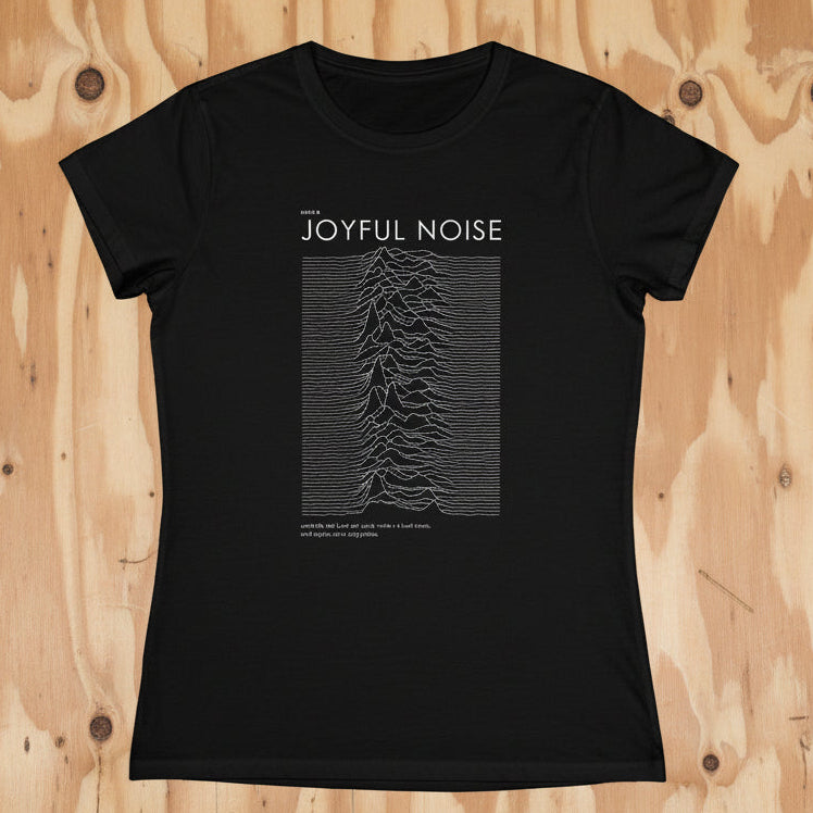 A black short-sleeved women's t-shirt with 'JOYFUL NOISE' printed on the front, featuring the iconic waveform pattern from Joy Division.