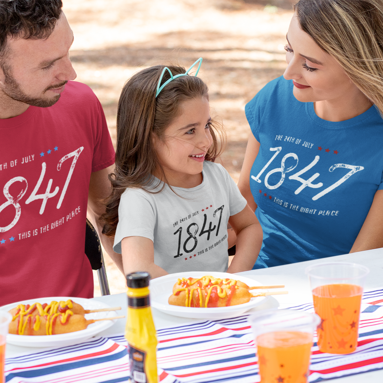 A family wearing matching Days of 47, July 24th 1847 t-shirts