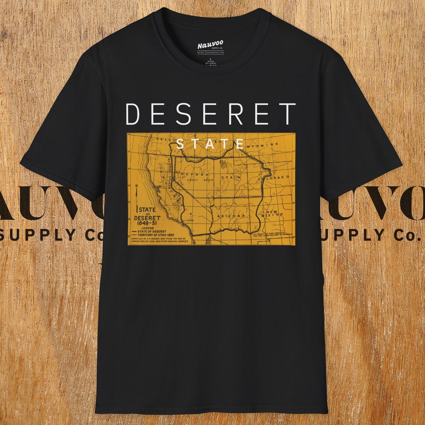 Black t-shirt with 'Deseret State' design on a wooden background