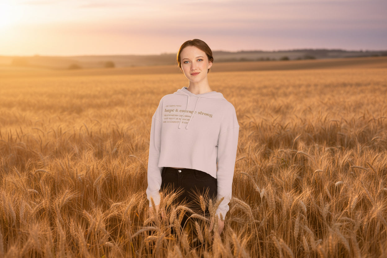 a model wearing a hope and courage strong cropped hoodie by Nauvoo Supply Co